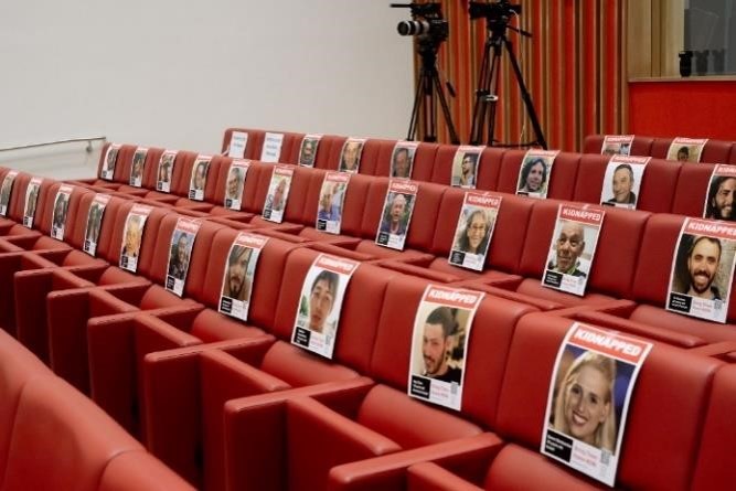 Theater chairs with pictures of the abductees